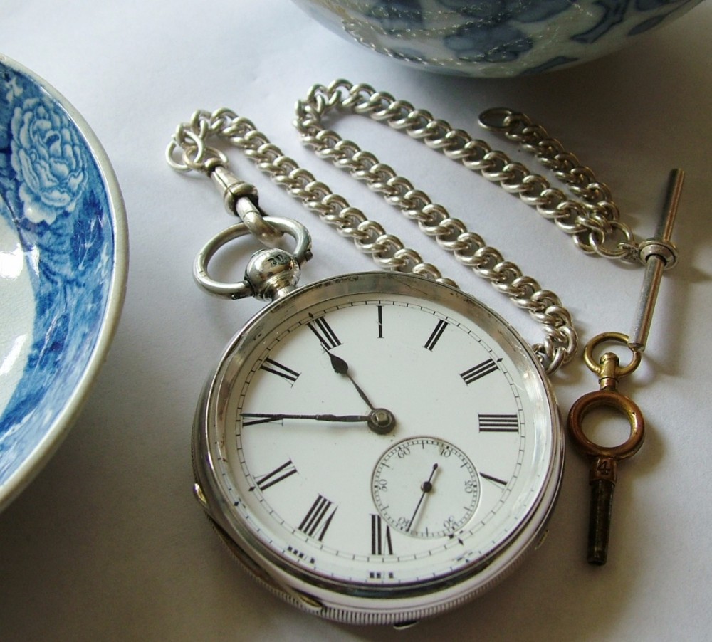 An antique silver fusee pocket watch and chain