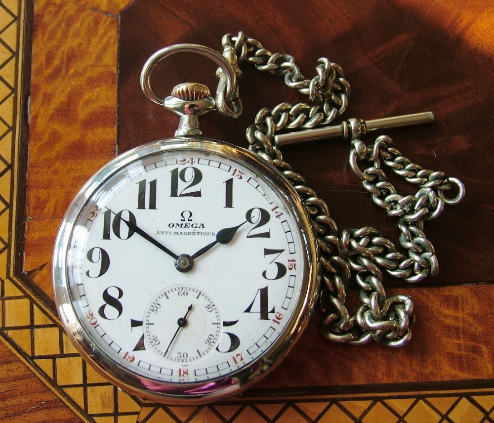 A 1920s Omega pocket watch and chain