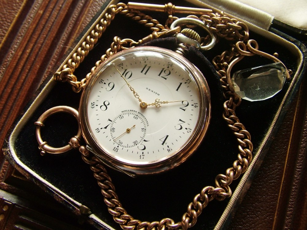An antique Zenith pocket watch, chain and box