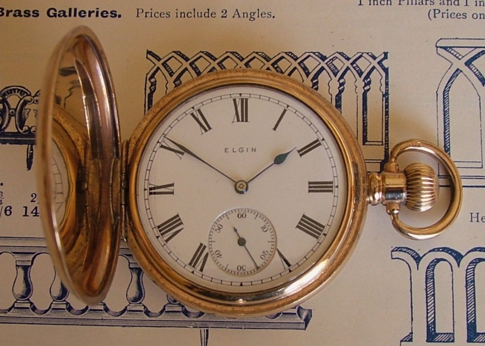 An antique Elgin full hunter pocket watch.