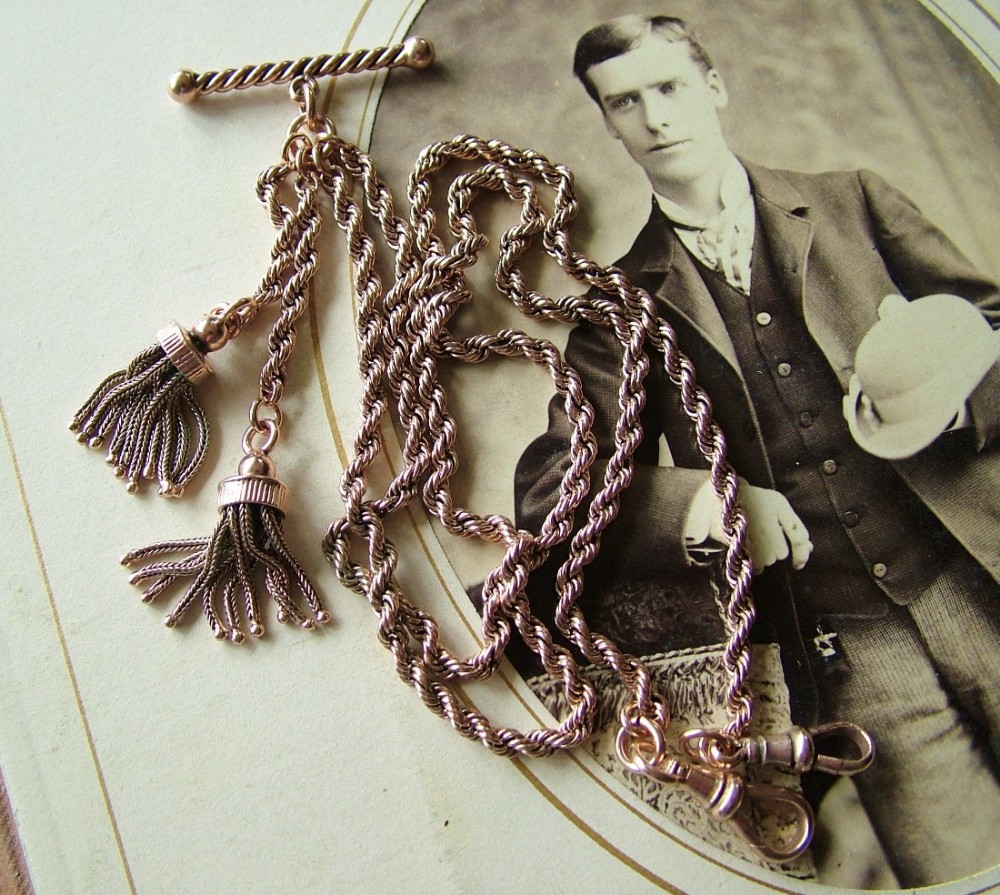 An antique rose gold plated double watch chain