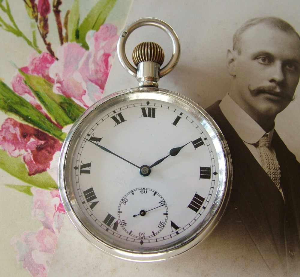 An antique silver Record pocket watch, 1918
