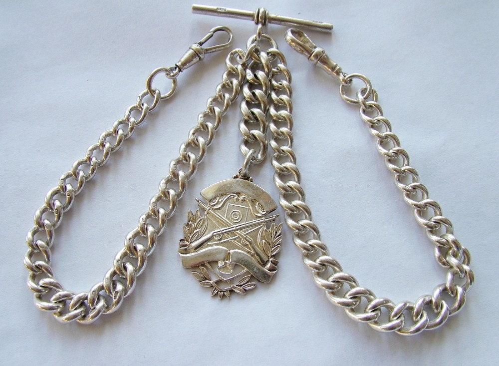 Antique silver watch chain with rifle shooting fob