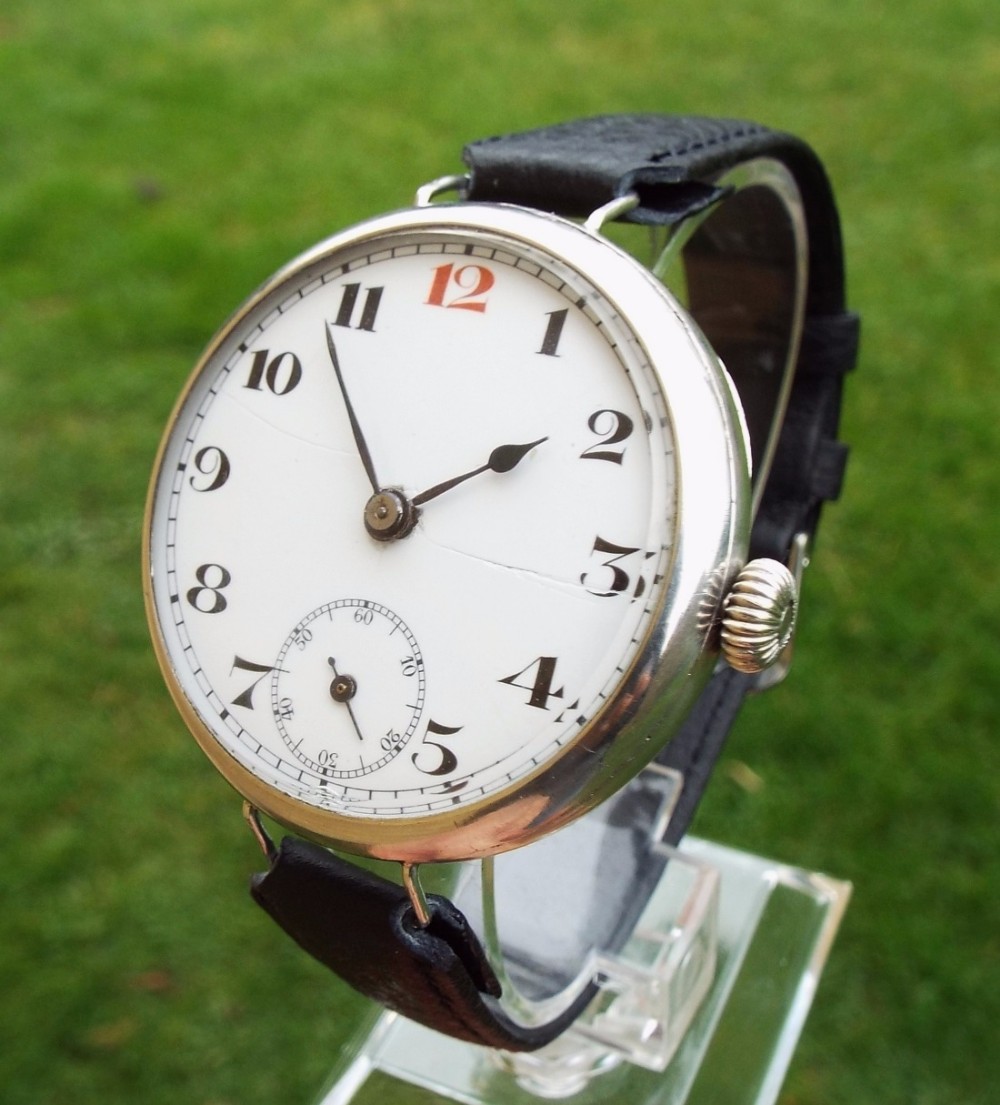 An Officer’s antique silver over-sized wrist watch