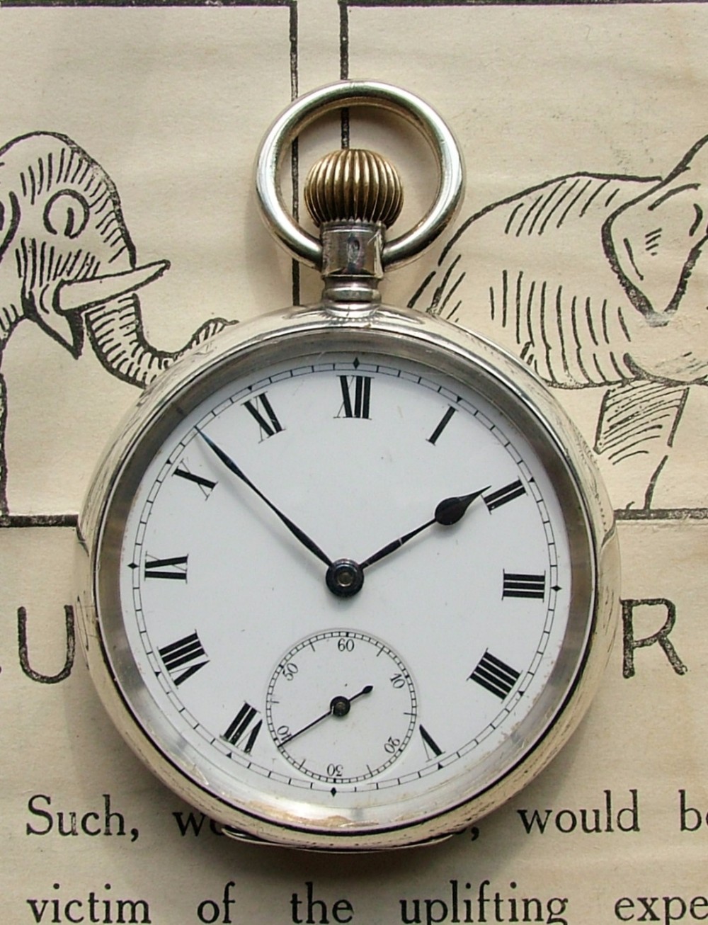 Antique 1909  silver stem winding pocket watch.