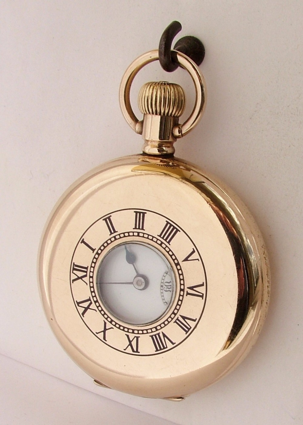 A 1920s half hunter pocket watch.