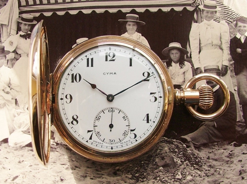 A 1920s Cyma full hunter pocket watch.