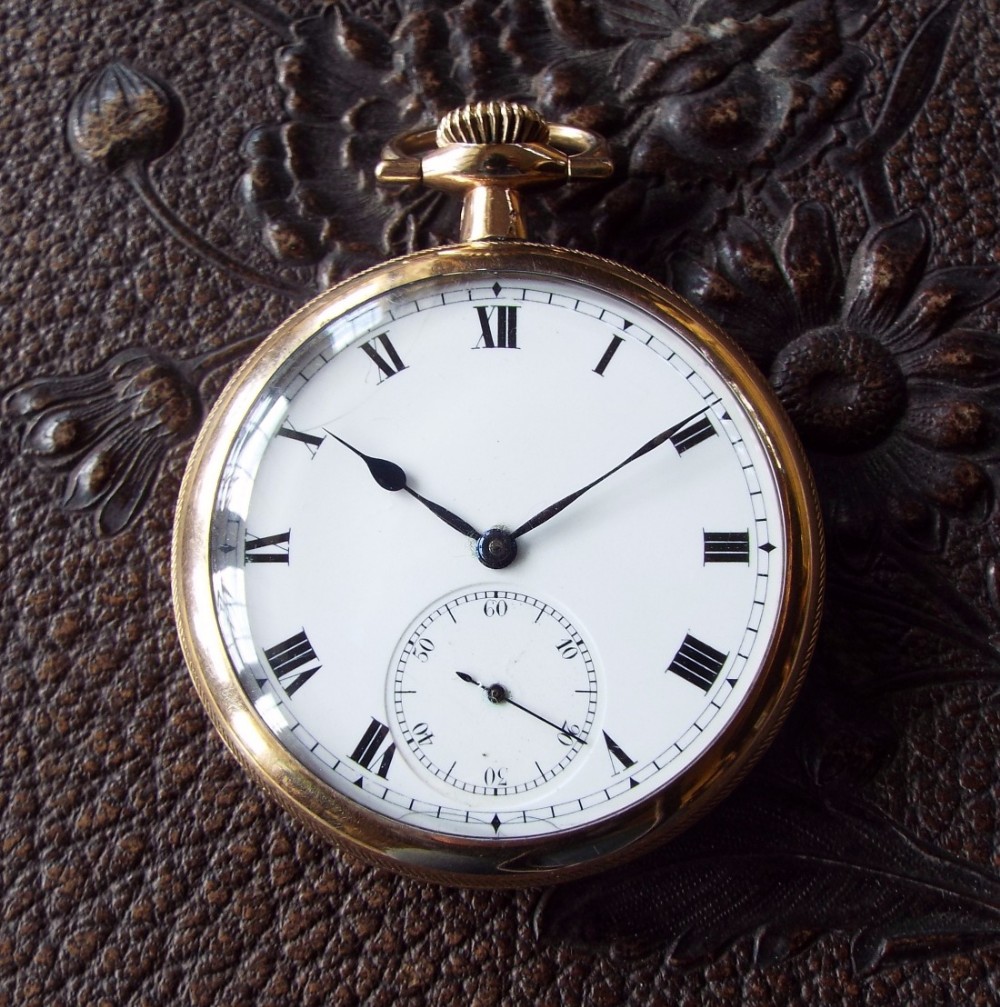 An ornate antique open faced Pioneer pocket watch