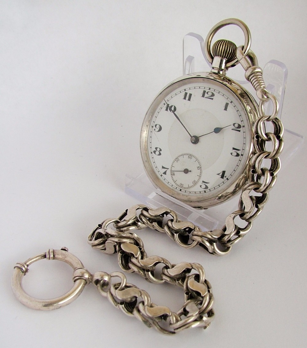  1920s silver pocket watch and chain.