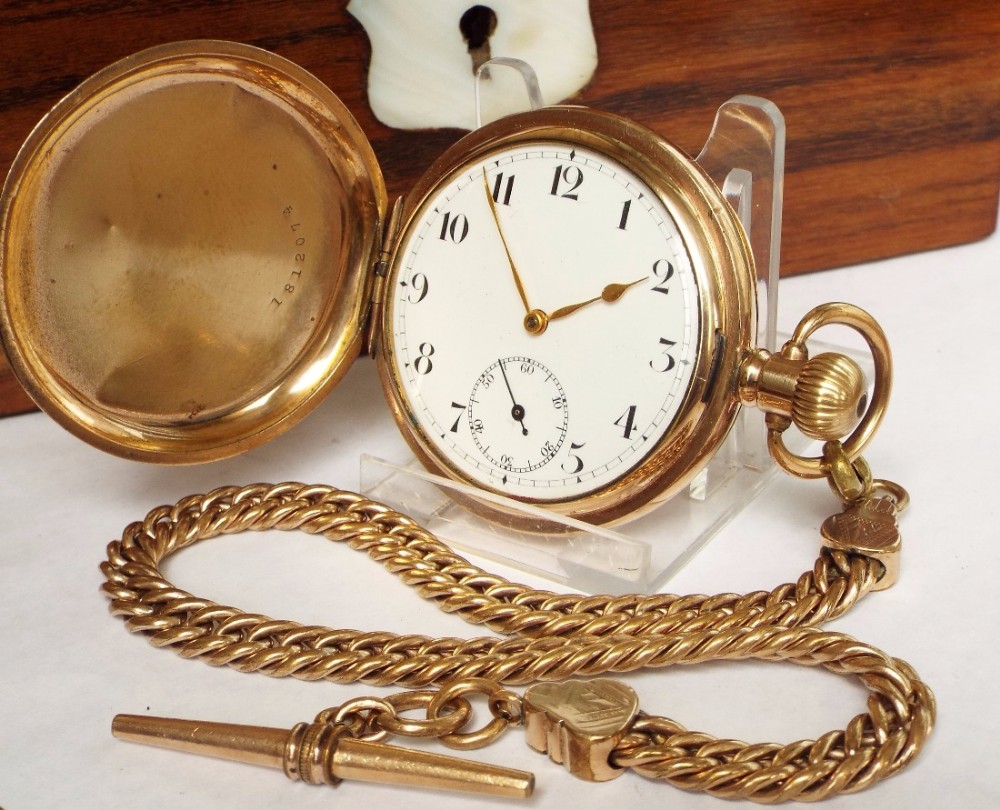 An antique full hunter pocket watch from Kay & Co Ltd, with chain