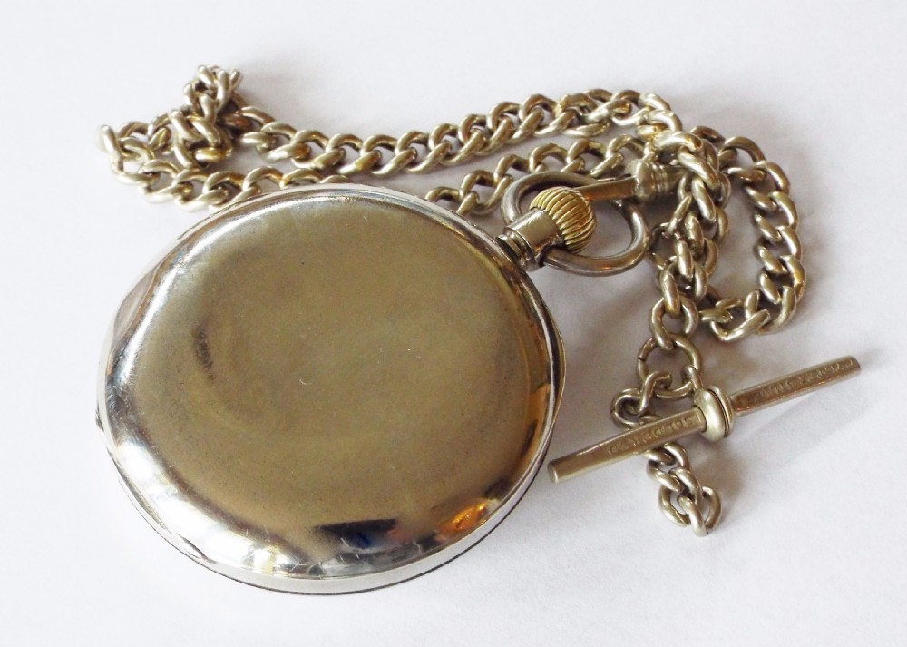 An antique Omega pocket watch with chain View V