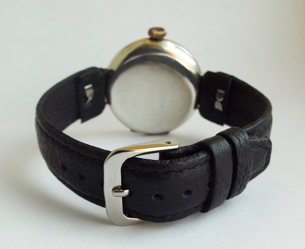 A gents 1915 silver trench watch View V