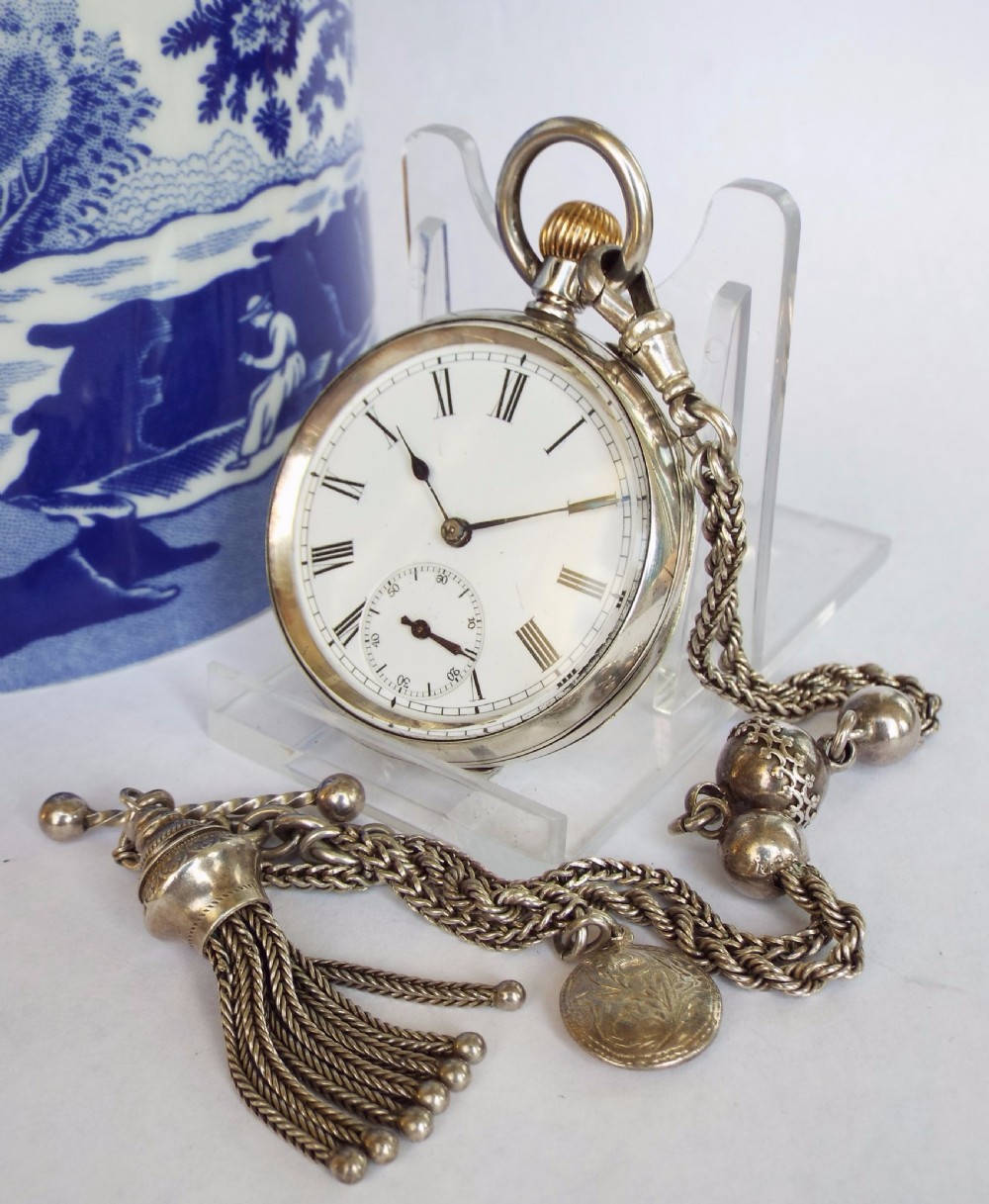 Small antique Swiss silver pocket watch and albertina