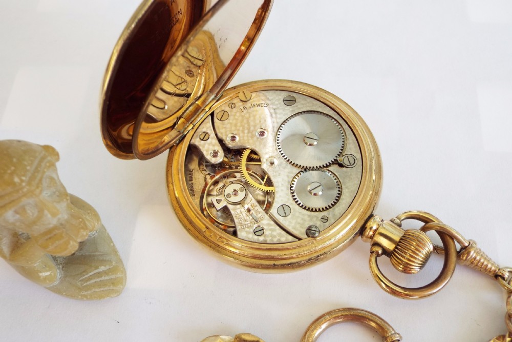 A 1920s gold plated pocket watch and chain View IV