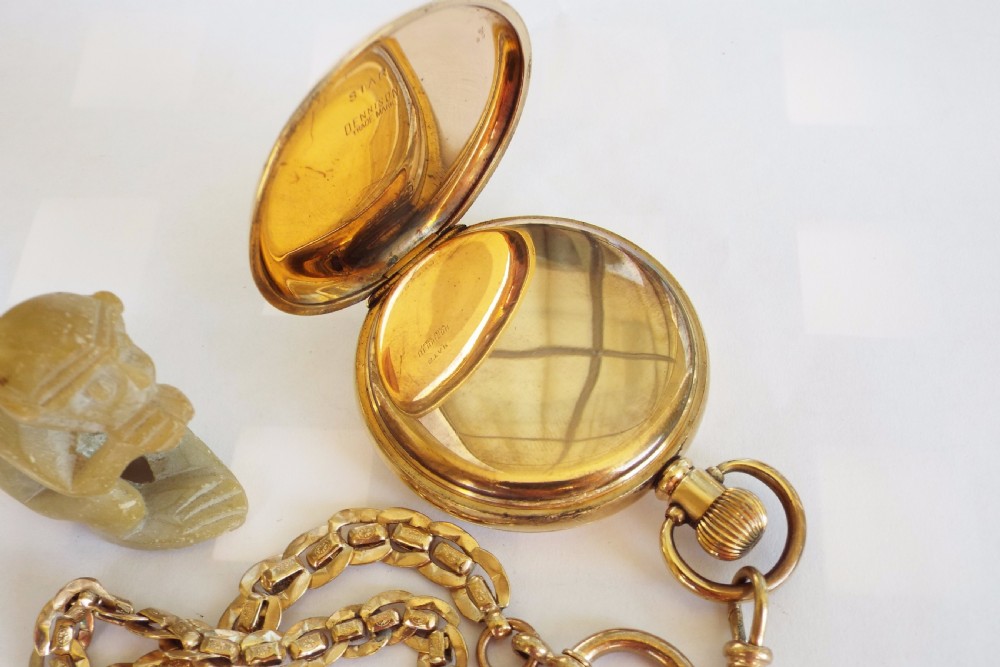 A 1920s gold plated pocket watch and chain View V