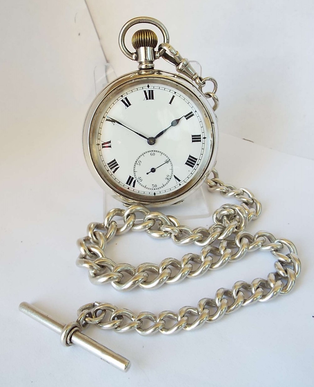 1914 silver pocket watch and chain.