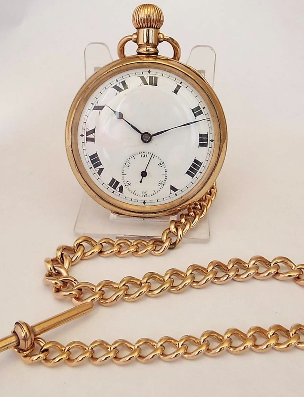 A 1920s Swiss stem winding pocket watch & chain.