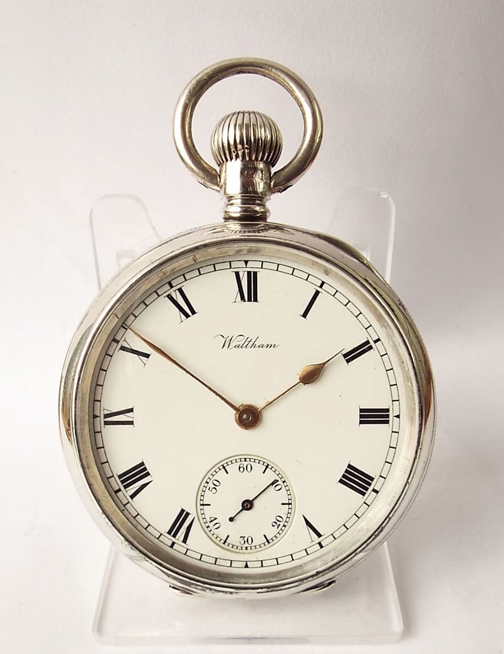 An antique silver Waltham pocket watch, 1910.