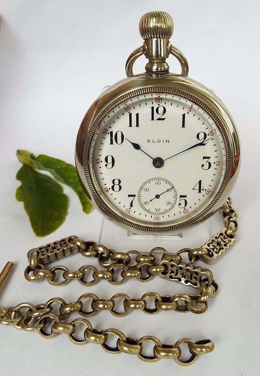 A large 1914 Elgin pocket watch & chain.