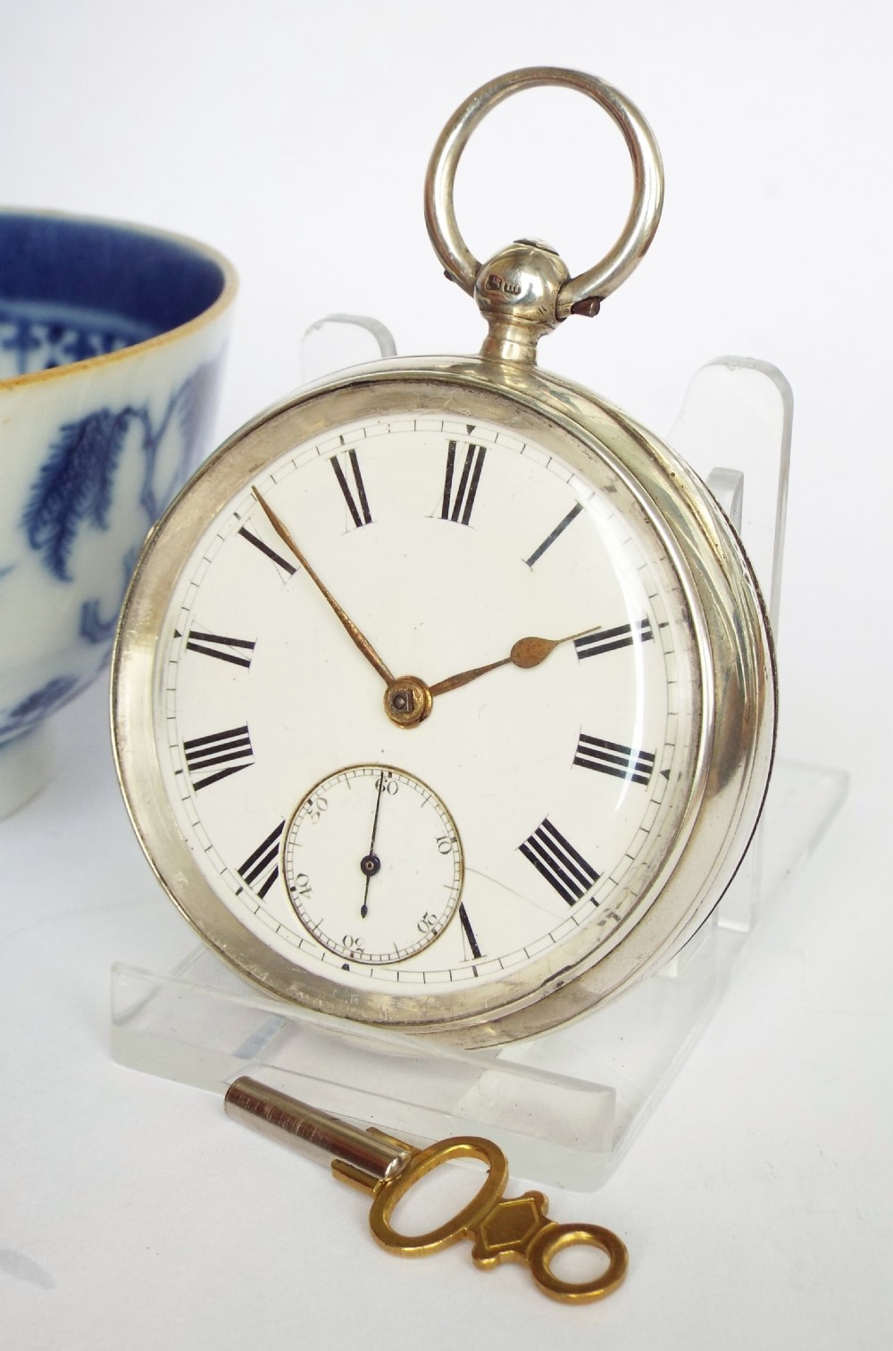 An antique English silver pocket watch, 1886