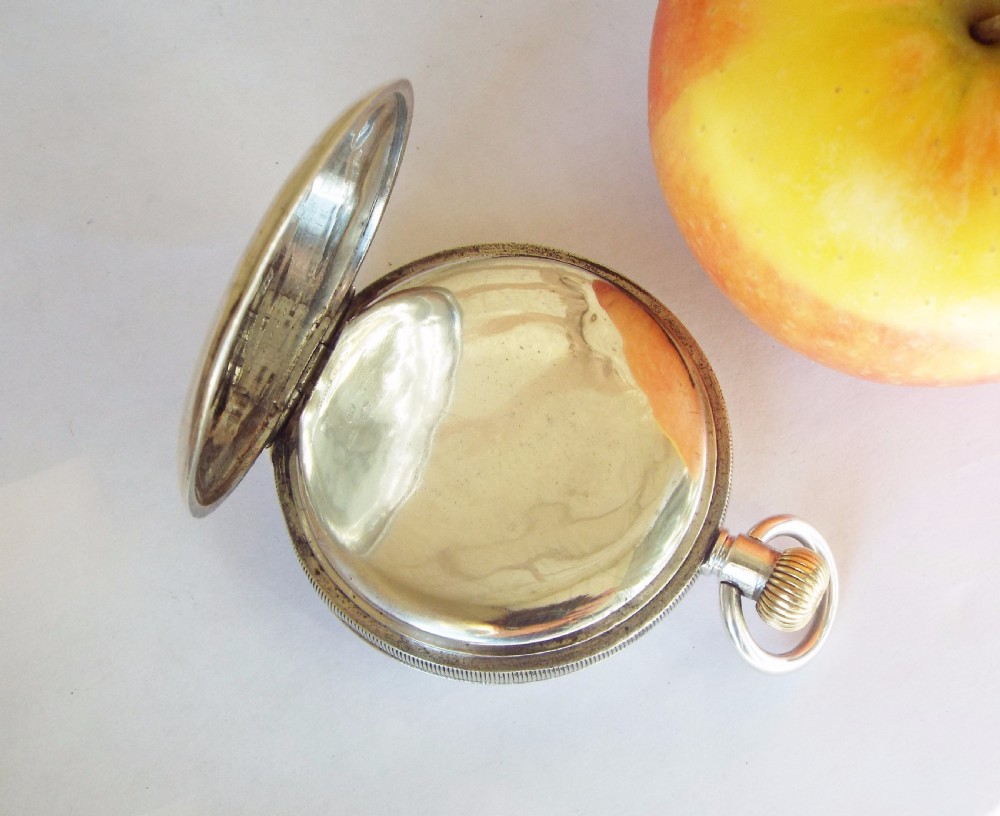 An antique Minerva half hunter pocket watch View III
