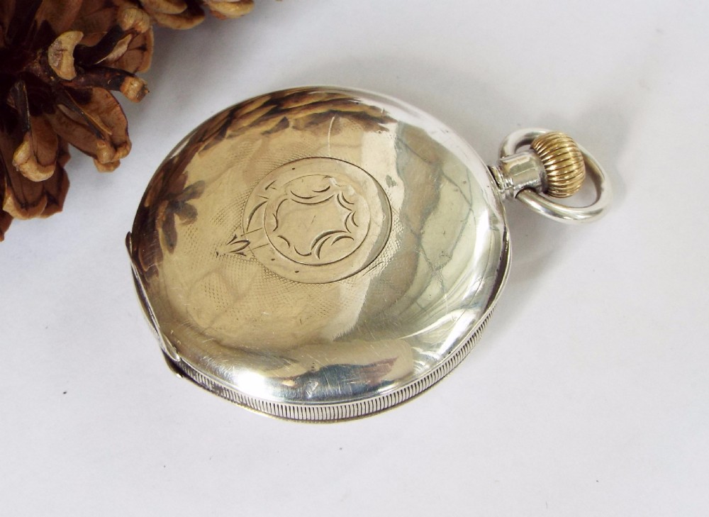 An antique Minerva half hunter pocket watch View V