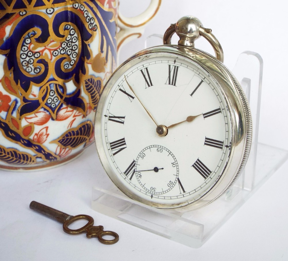 An antique silver Waltham pocket watch, 1887