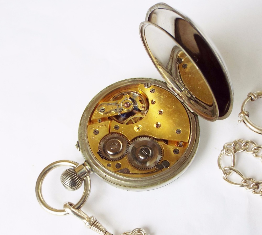 An antique 1908 Eterna pocket watch with chain View V