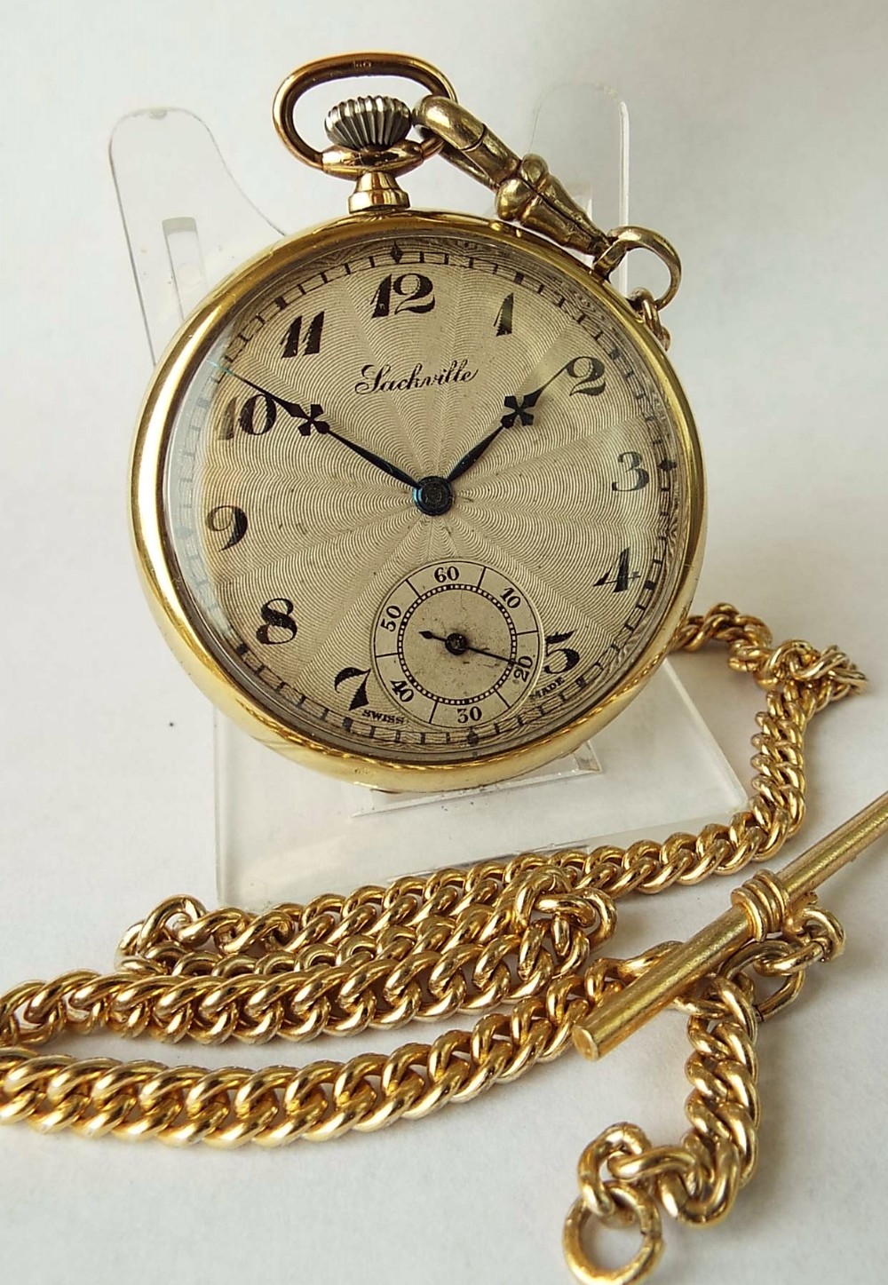 A vintage 1930s Sackville pocket watch & chain.