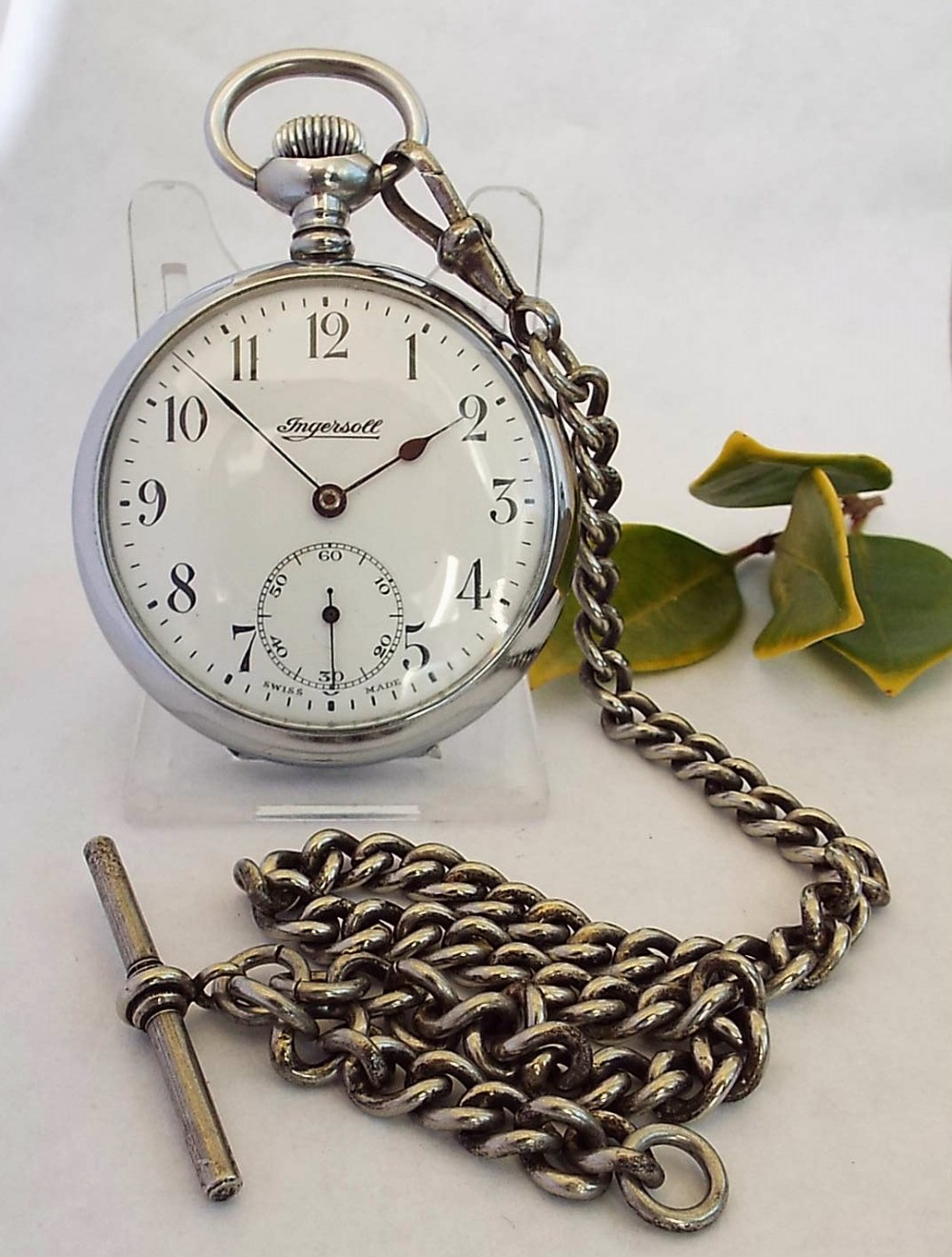 A 1920s Ingersoll Pocket Watch With Chain. 507545