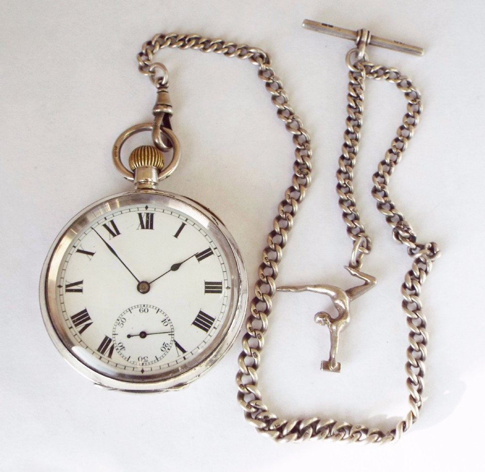 An antique silver Record pocket watch with chain View II