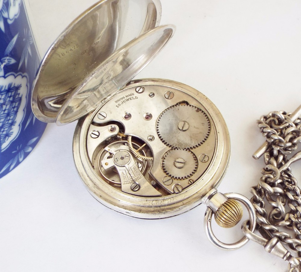 An antique silver Record pocket watch with chain View V