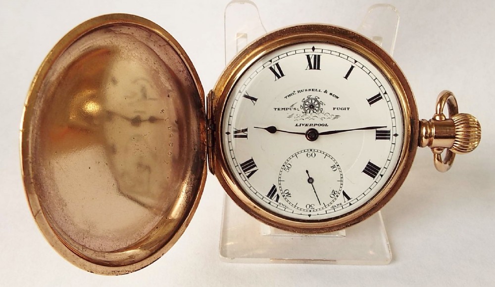 A 1920s Thomas Russell “Time O Day” full hunter pocket watch.