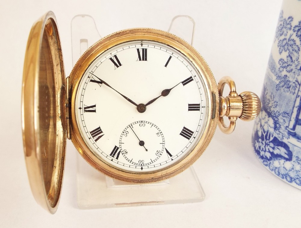 A 1920s Swiss full hunter pocket watch.