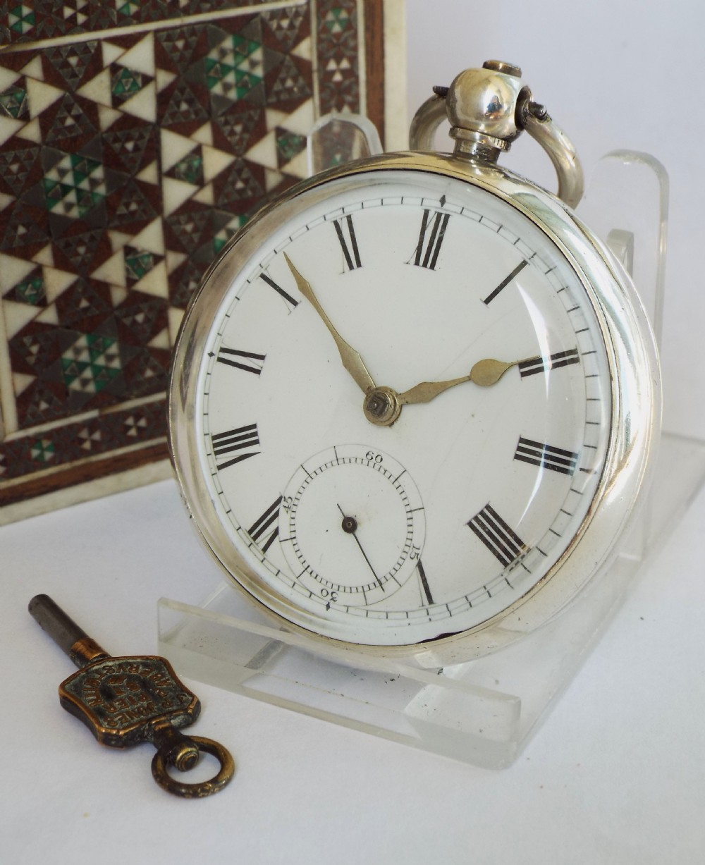 An antique 1876 silver Waltham pocket watch.