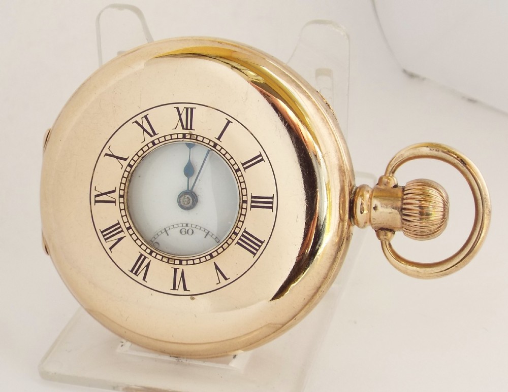 A 1920s Swiss half hunter pocket watch.