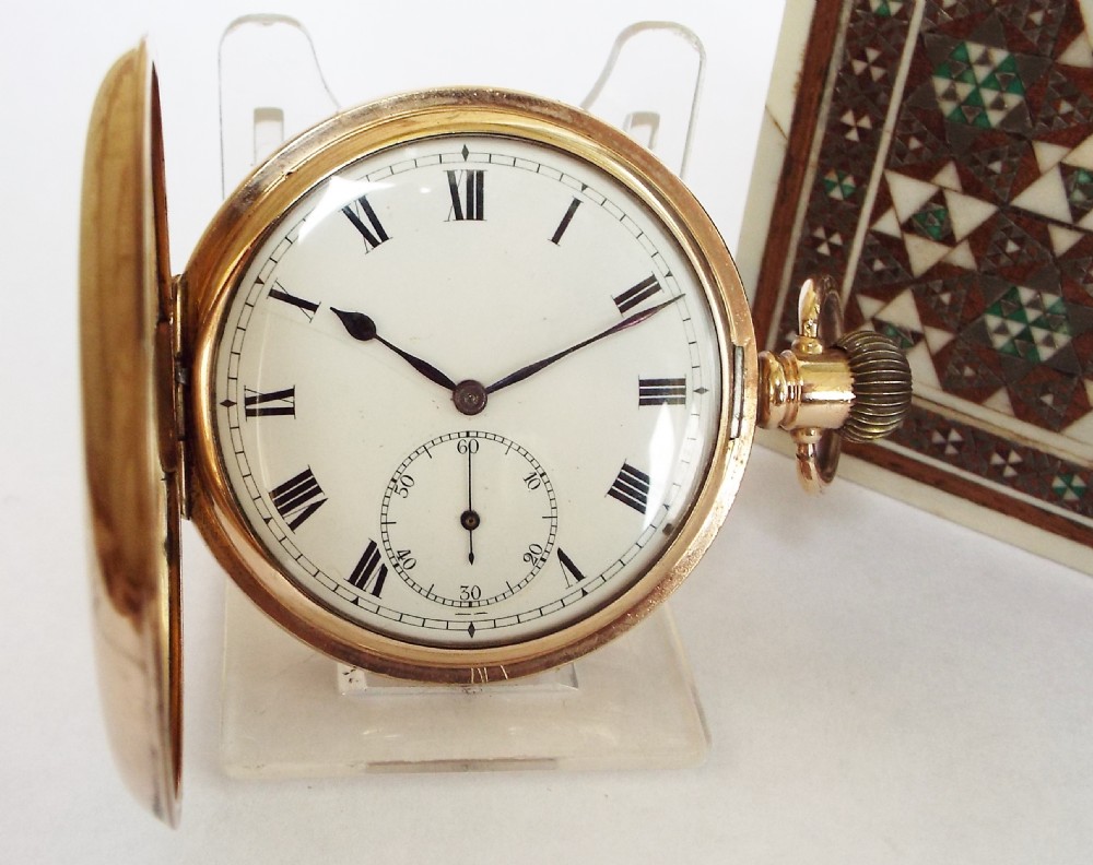 A 1920s Swiss full hunter pocket watch.