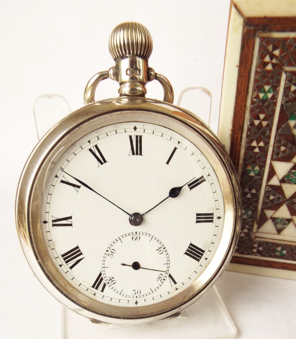 A 1920s silver Stauffer Son & Co pocket watch.