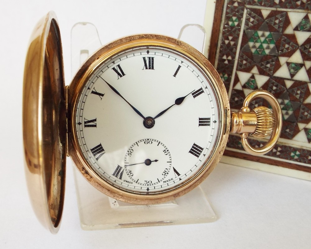 A 1920s Swiss full hunter pocket watch.
