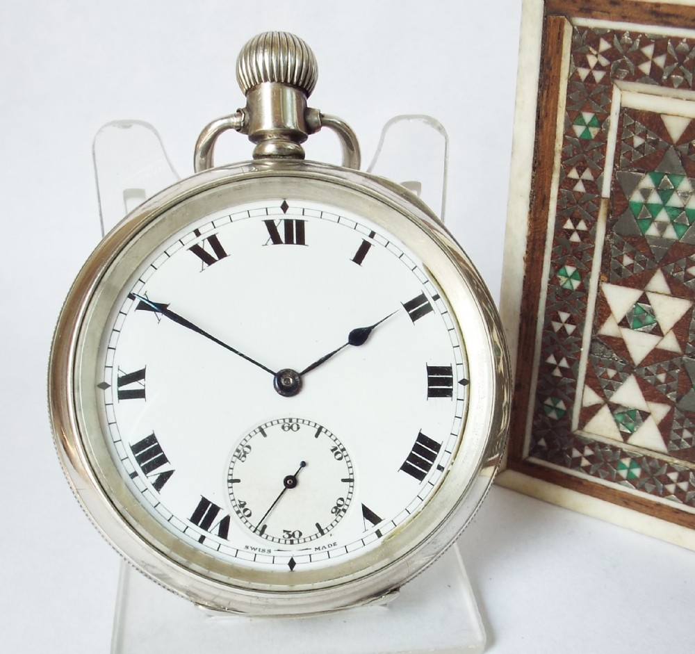 An antique silver pocket watch, 1918.
