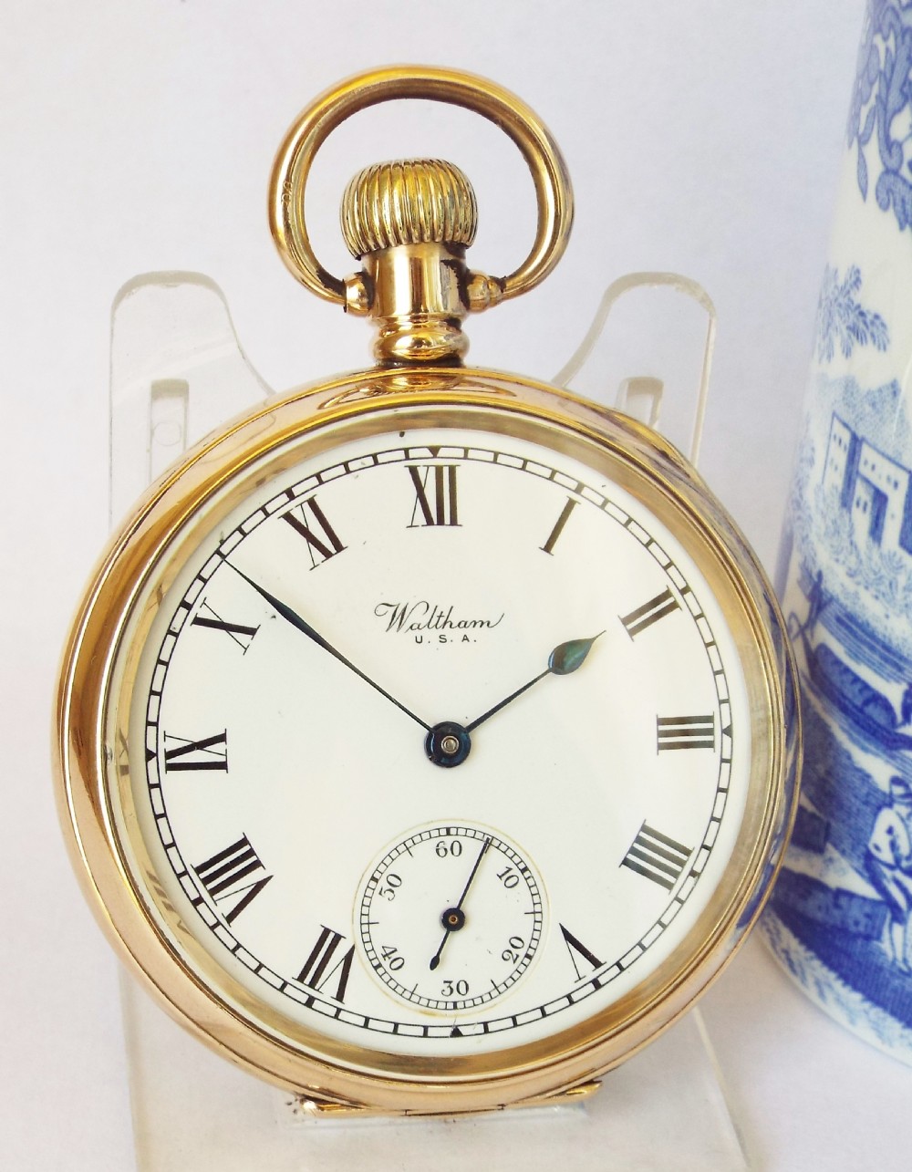 A 1930s stem winding Waltham pocket watch.