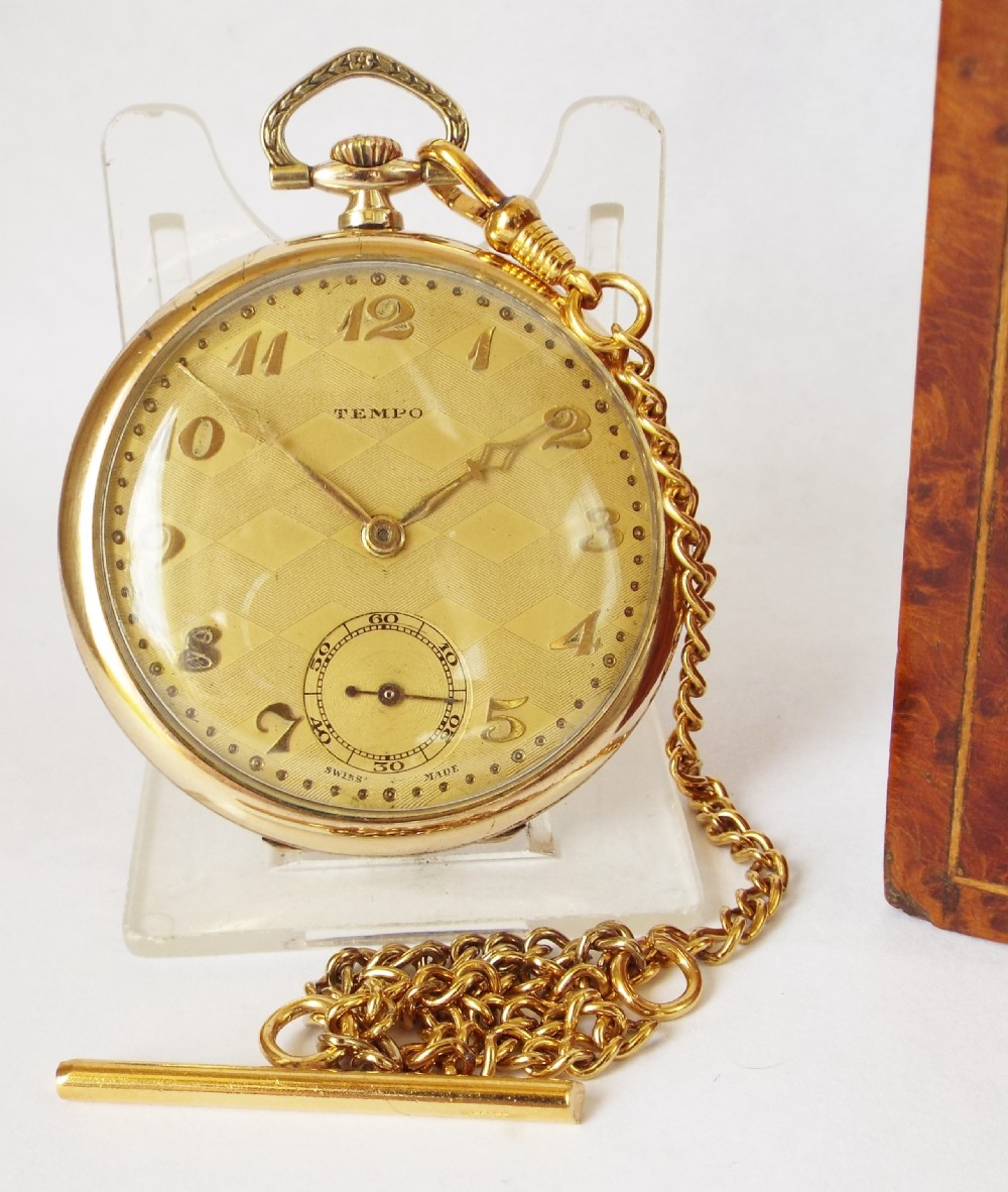 A 1930s Tempo pocket watch with chain.