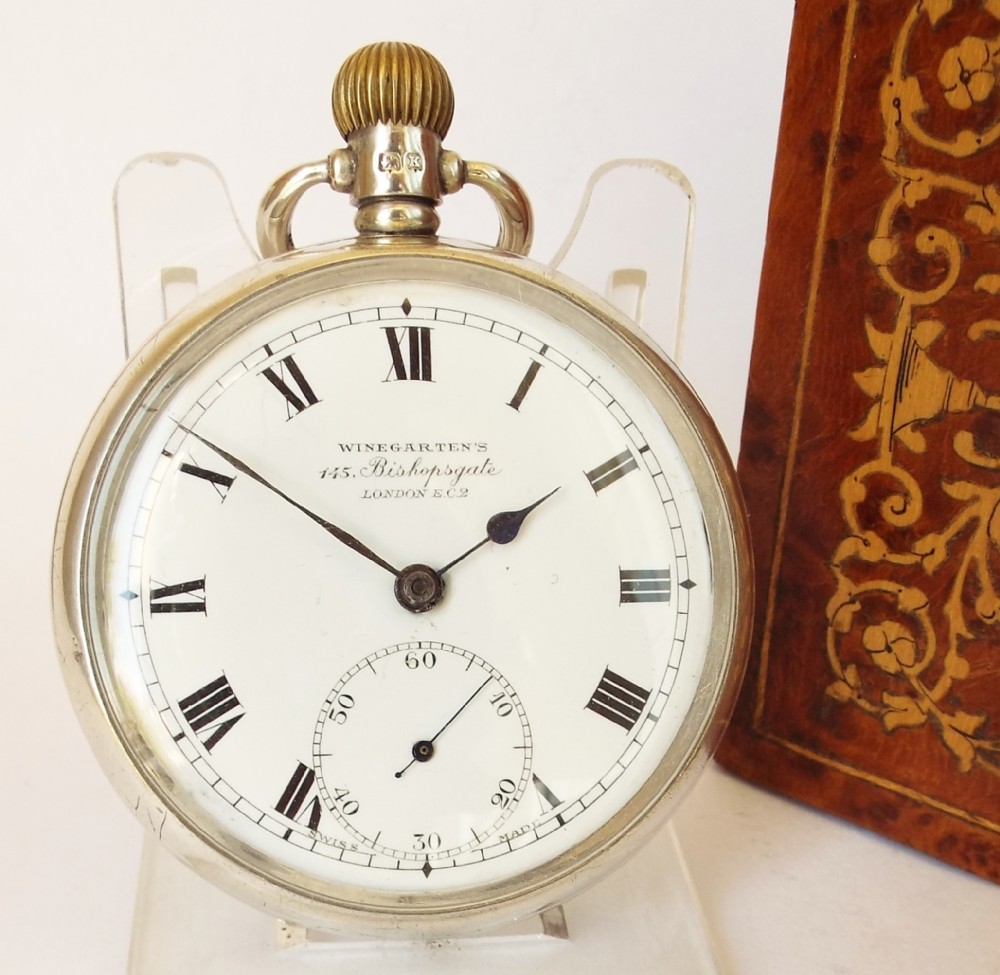 A vintage silver 1935 Cortebert pocket watch originally retailed by Winegartens London.