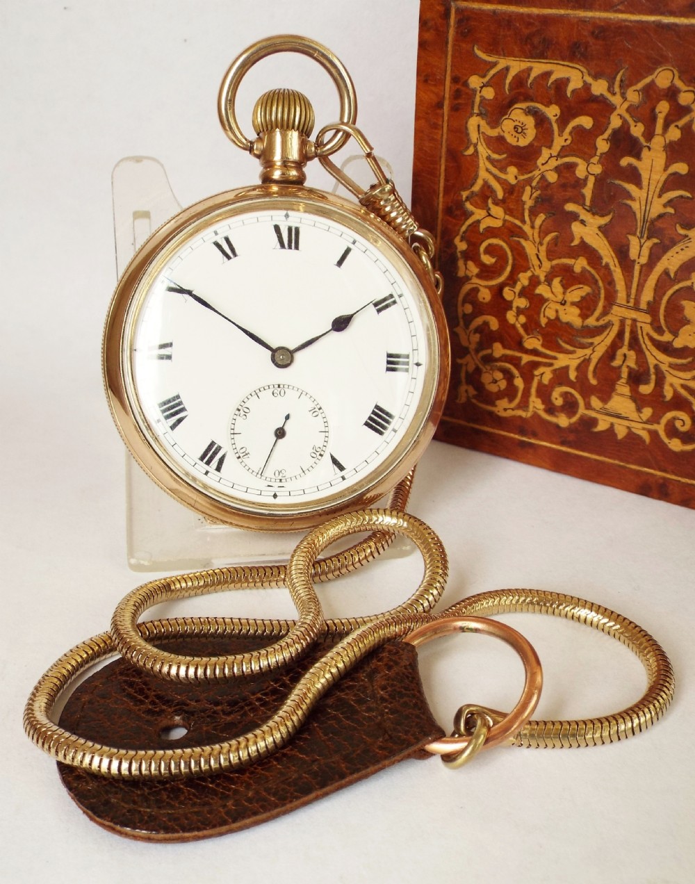 A 1930s Swiss pocket watch & chain.
