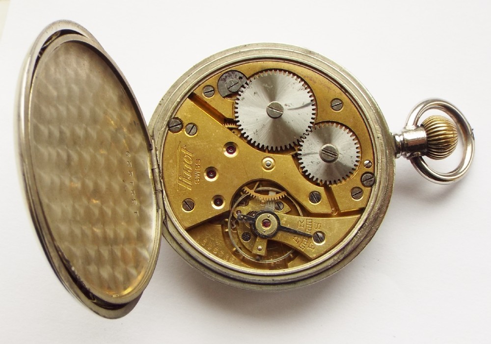 A WW2 era Tissot pocket watch. View V