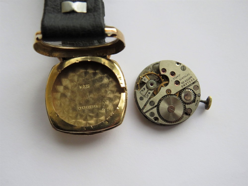9ct gold Invicta mid-size wrist watch by Seeland Watch Co View III
