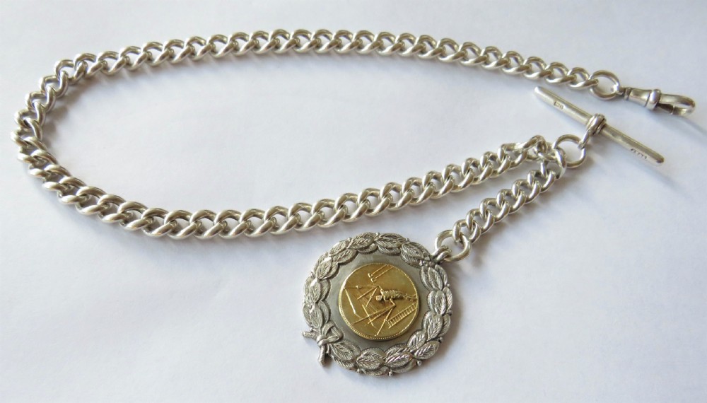 Antique silver pocket watch chain & gymnastics fob