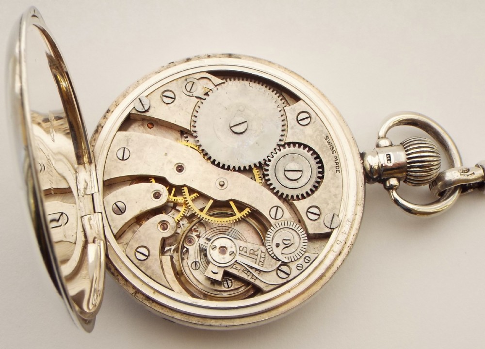 A 1920s silver pocket watch and chain. View V