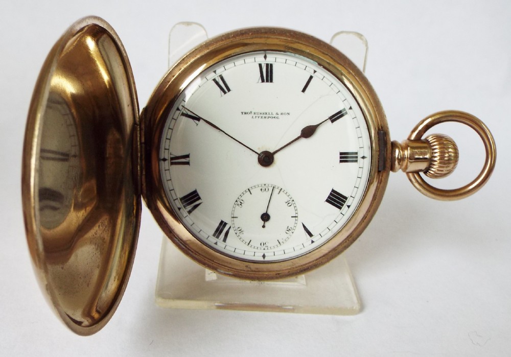 An antique full hunter pocket watch by Thomas Russell.