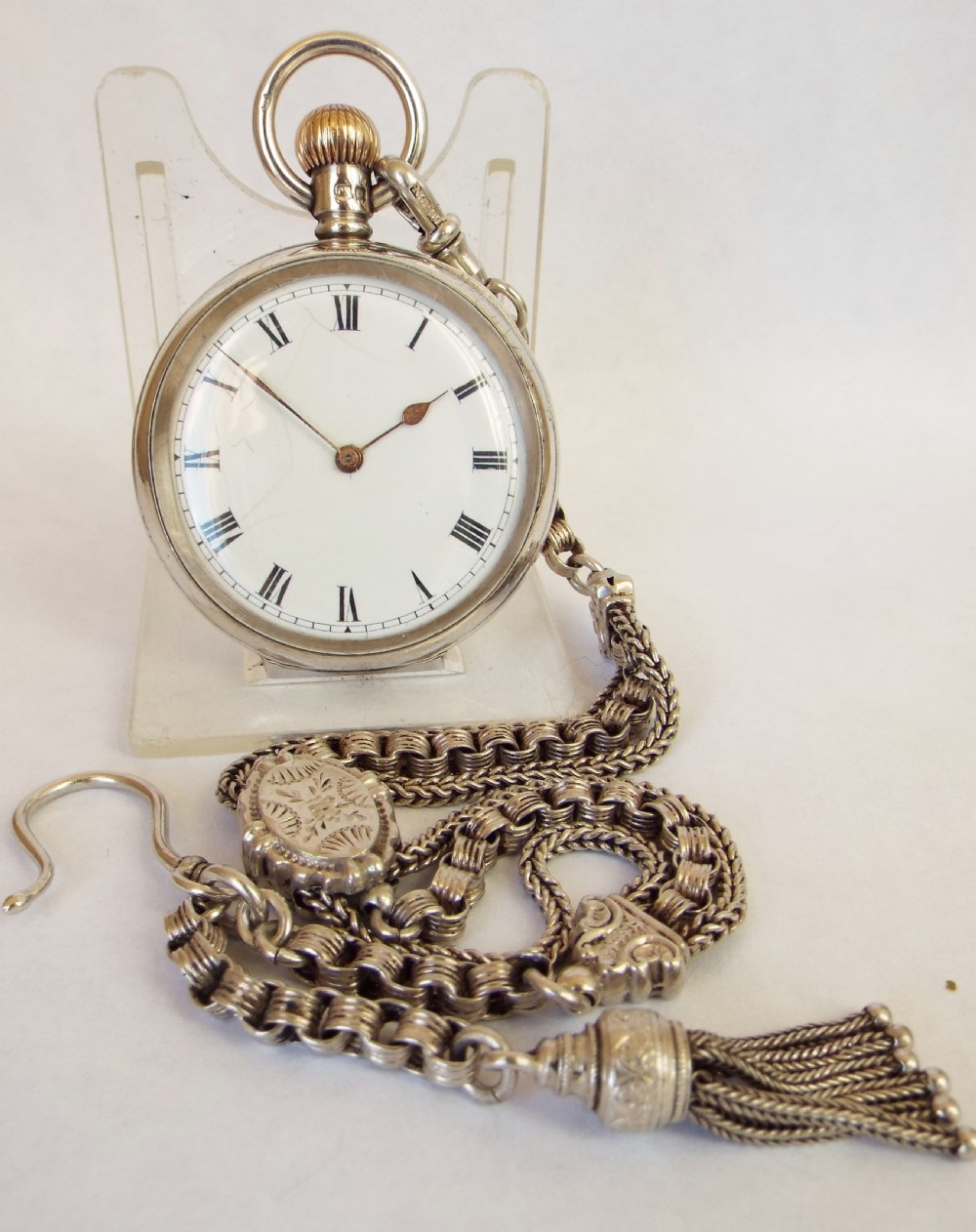 A lady’s antique silver Waltham fob watch and chain.